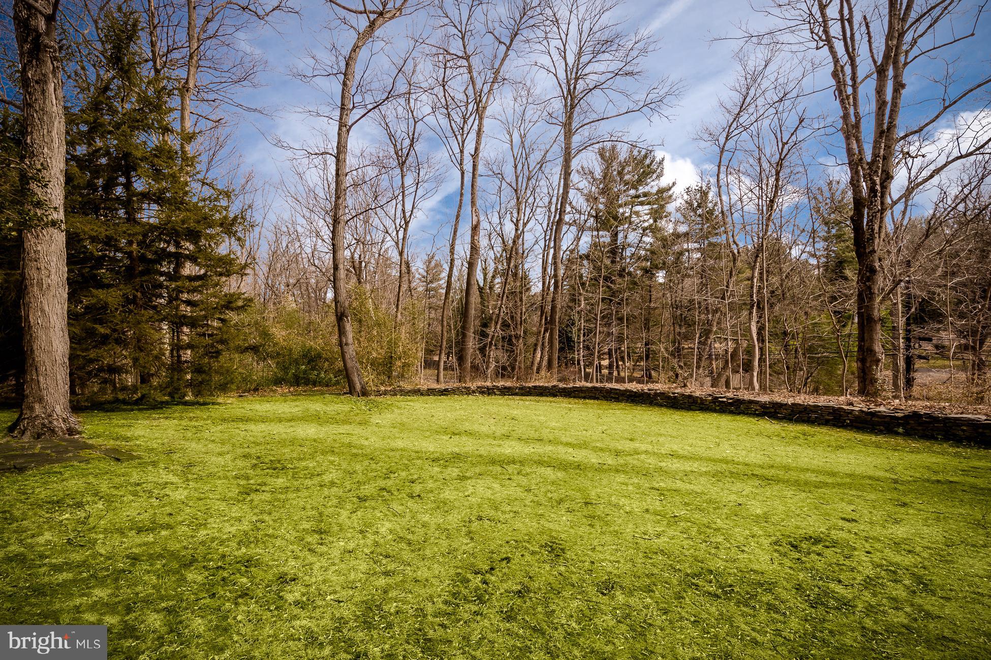 52 Winant Road Princeton, NJ 08540 - Photo 31 of 32 a backyard of a building with large trees