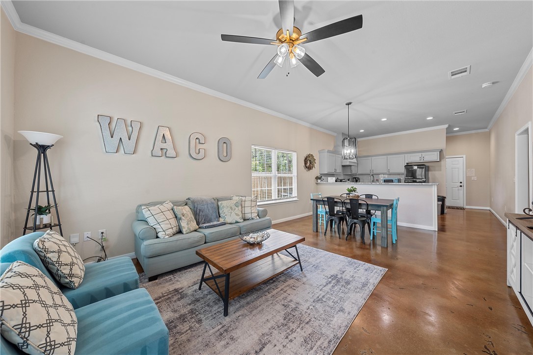 1121 Brook Avenue Waco, TX 76708 - Photo 1 of 19 a living room with furniture and a large window