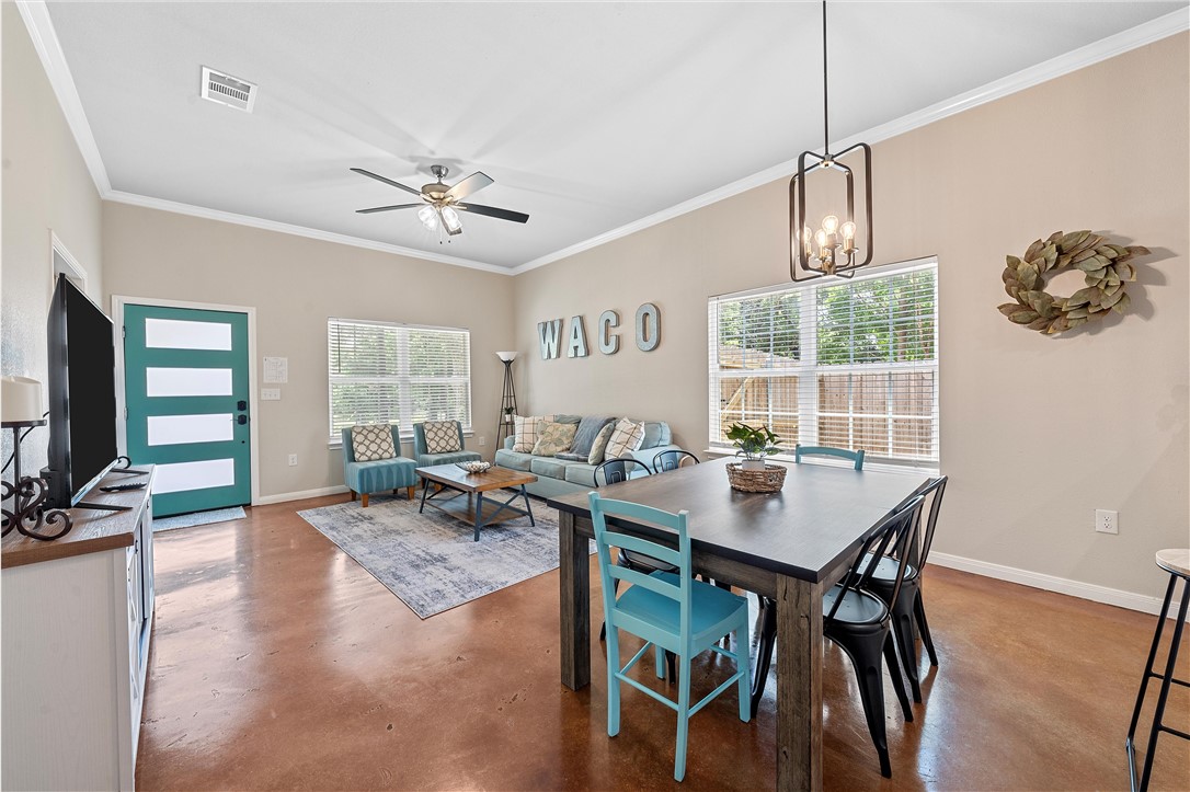 1121 Brook Avenue Waco, TX 76708 - Photo 4 of 19 a view of a dining room with furniture window and wooden floor
