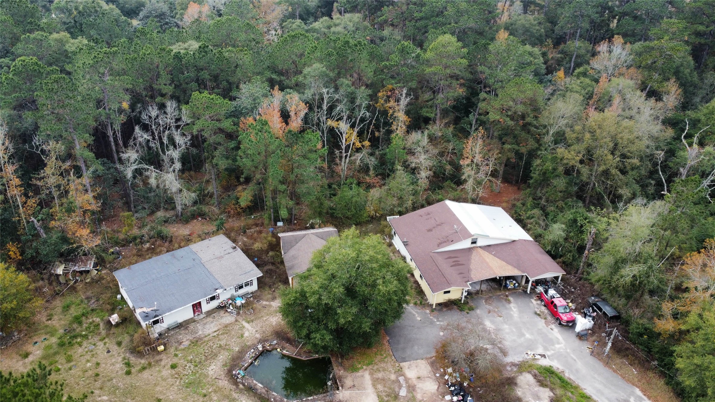 an aerial view of a house with yard
