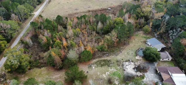 an aerial view of residential house with outdoor space