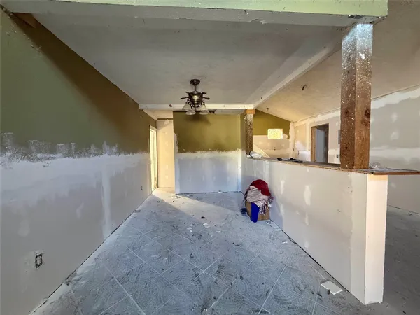 a view of a hallway with two windows