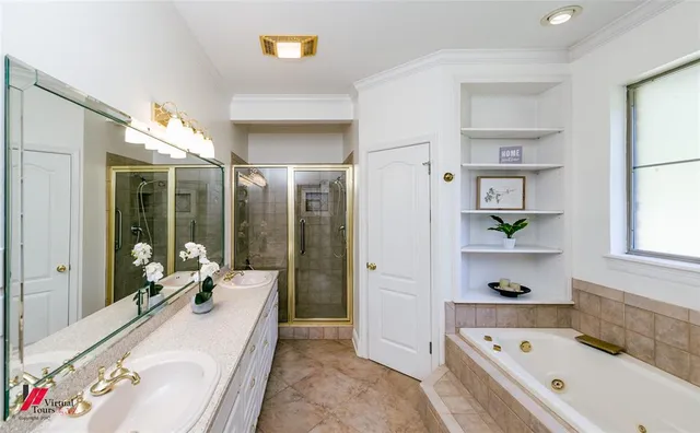 a spacious bathroom with a tub sink and mirror