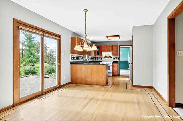 a kitchen with stainless steel appliances granite countertop a sink and a stove