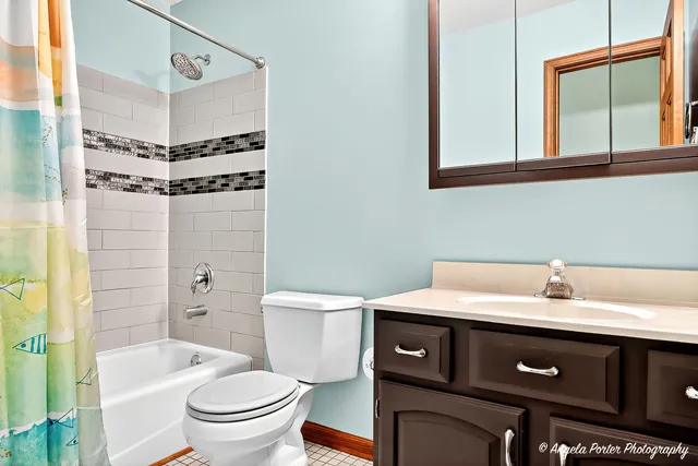 a spacious bedroom with a bed and glass window