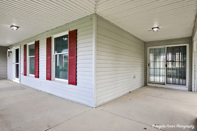 a living room with fireplace furniture and a flat screen tv