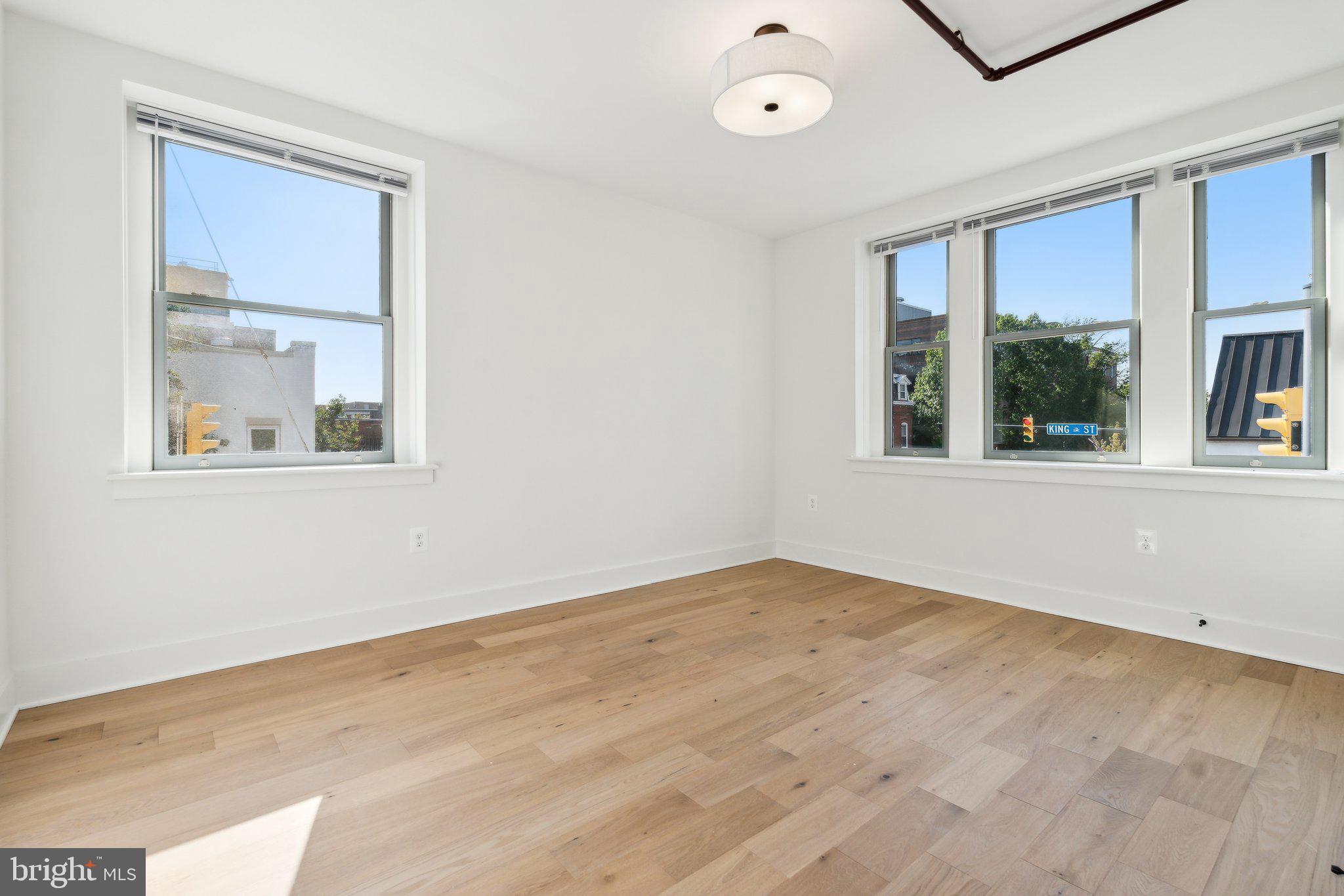 901 King Street, Unit 203 Alexandria, VA 22314 - Photo 13 of 52 an empty room with a window