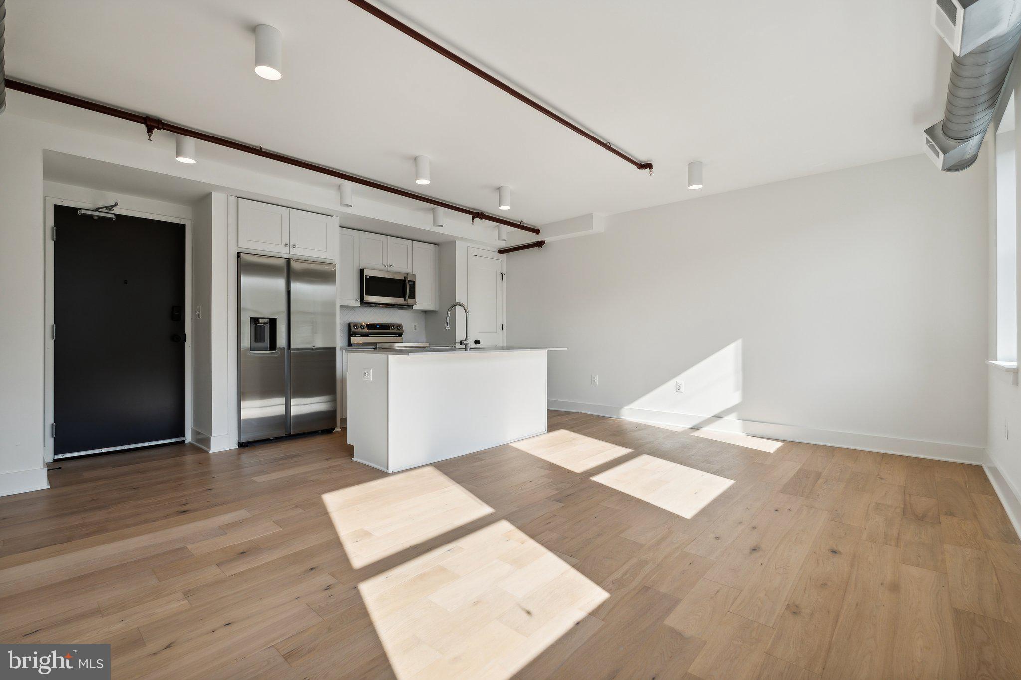 901 King Street, Unit 203 Alexandria, VA 22314 - Photo 20 of 52 a view of kitchen with furniture and refrigerator