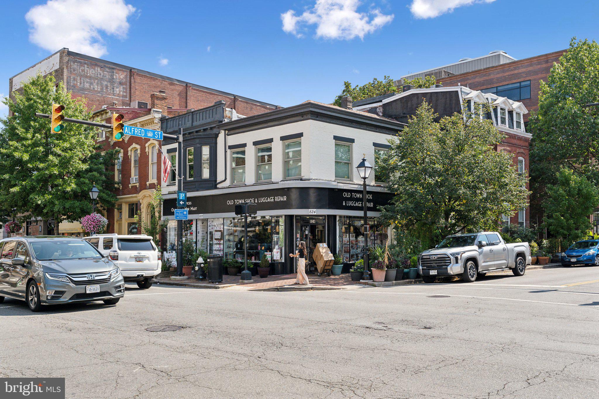 901 King Street, Unit 203 Alexandria, VA 22314 - Photo 38 of 52 a front view of a building with cars parked