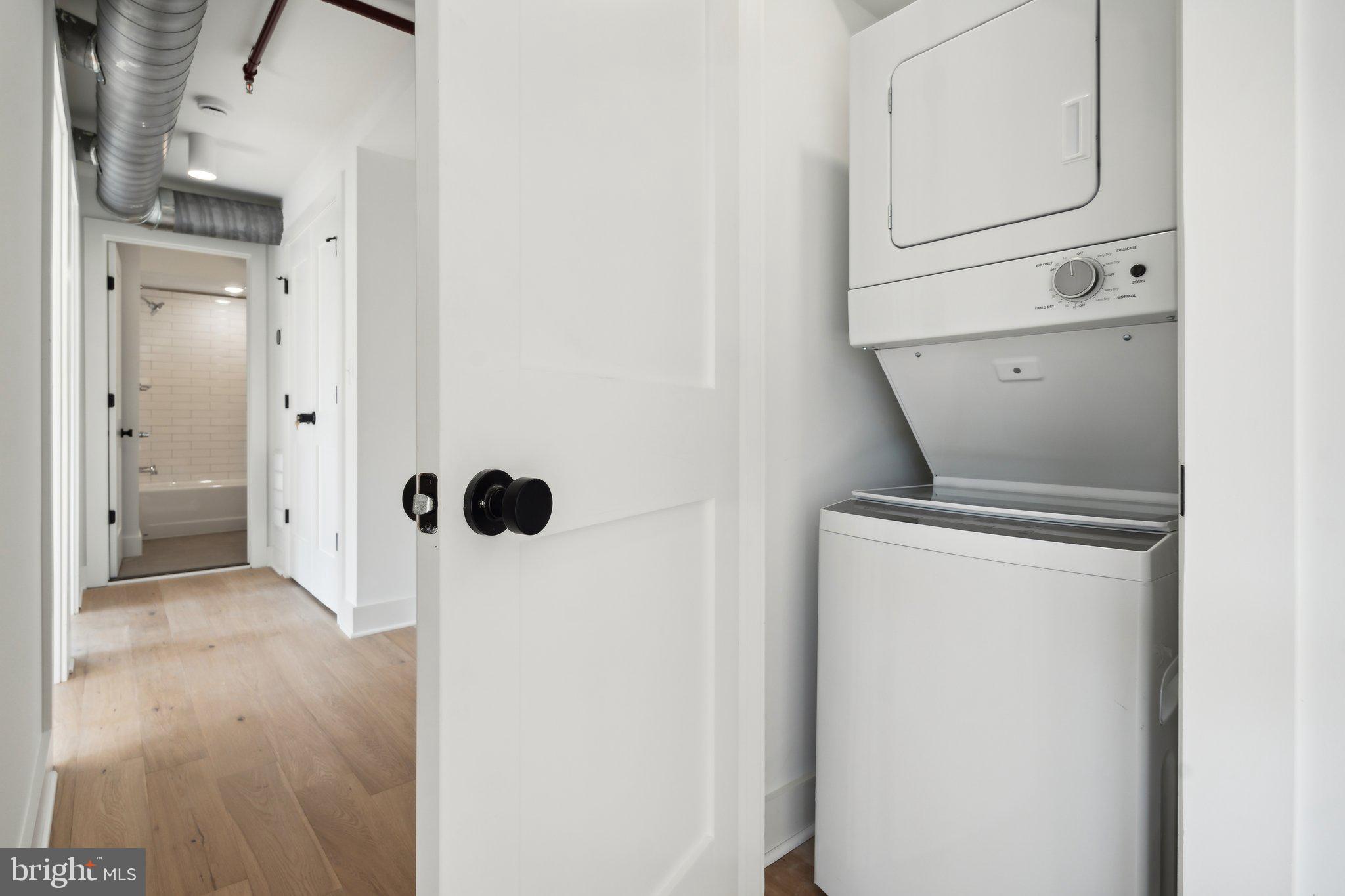 901 King Street, Unit 203 Alexandria, VA 22314 - Photo 9 of 52 a view of an empty room with wooden floor