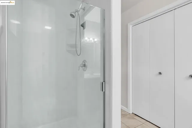 a bathroom with a glass shower door