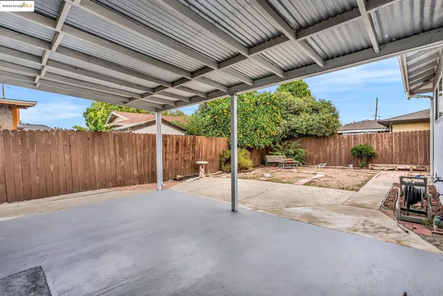 a view of a backyard with a patio
