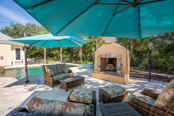 a swimming pool view with a outdoor seating