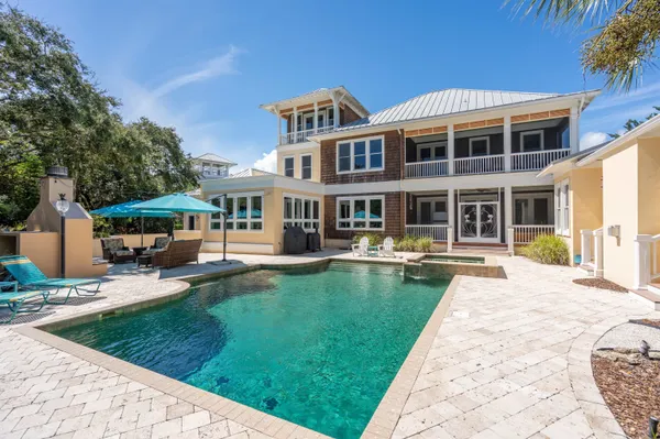 a view of living room with furniture and wooden floor