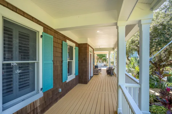 a view of a balcony with wooden floor