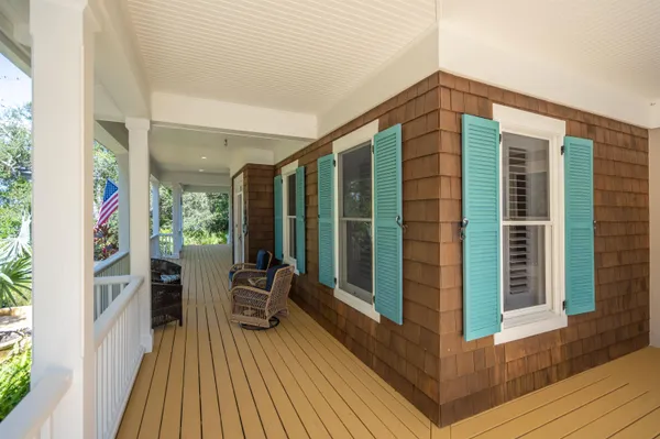 a bedroom with a bed next to a window