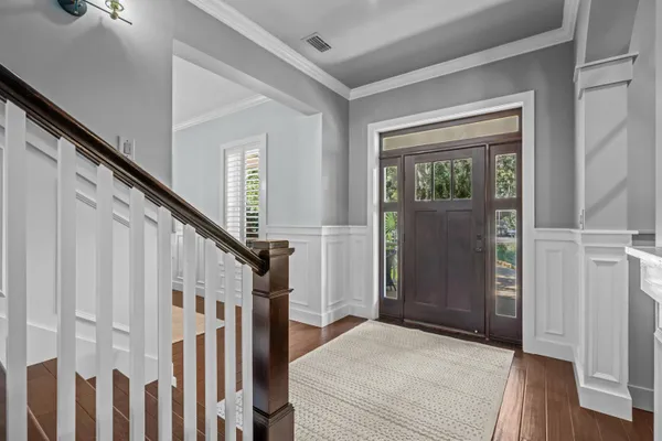 a bathroom with a sink and mirror with toilet