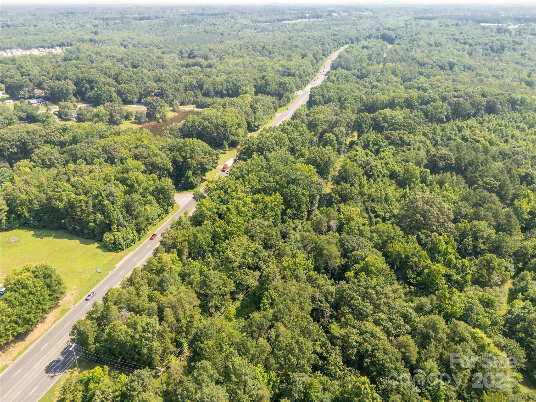 1853 Old York Road York, SC 29745 - Photo 9 of 14 a view of a green field with lots of bushes