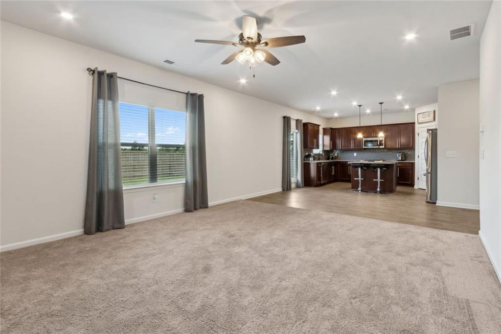 1130 Lyndhurst Lane Bethlehem, GA 30620 - Photo 13 of 46 a view of a livingroom with furniture and a ceiling fan