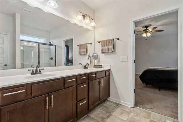 a view of walk in closet with clothes