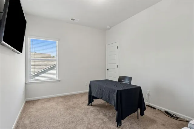 a bedroom with a bed and cabinets