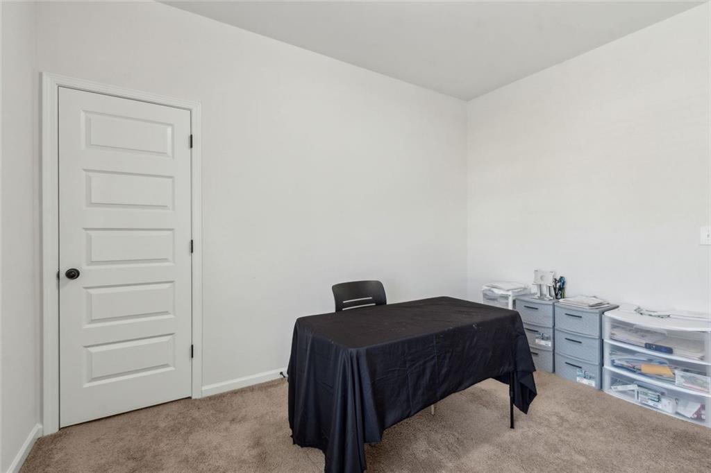 1130 Lyndhurst Lane Bethlehem, GA 30620 - Photo 39 of 46 a bedroom with a bed and cabinets