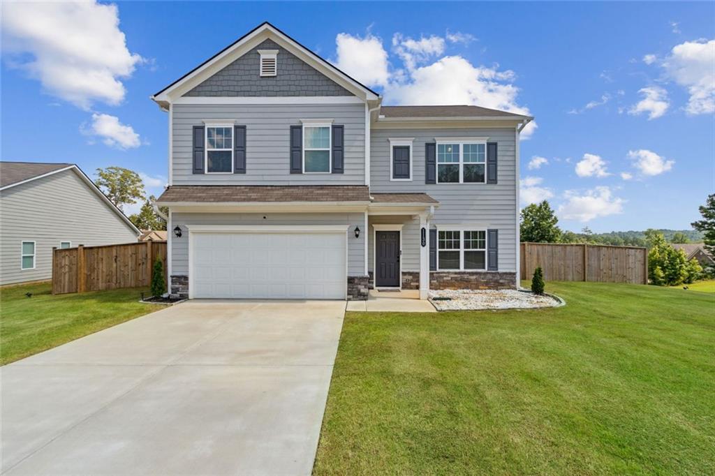 1130 Lyndhurst Lane Bethlehem, GA 30620 - Photo 4 of 46 a front view of a house with a yard and garage