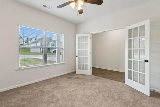 an empty room with windows