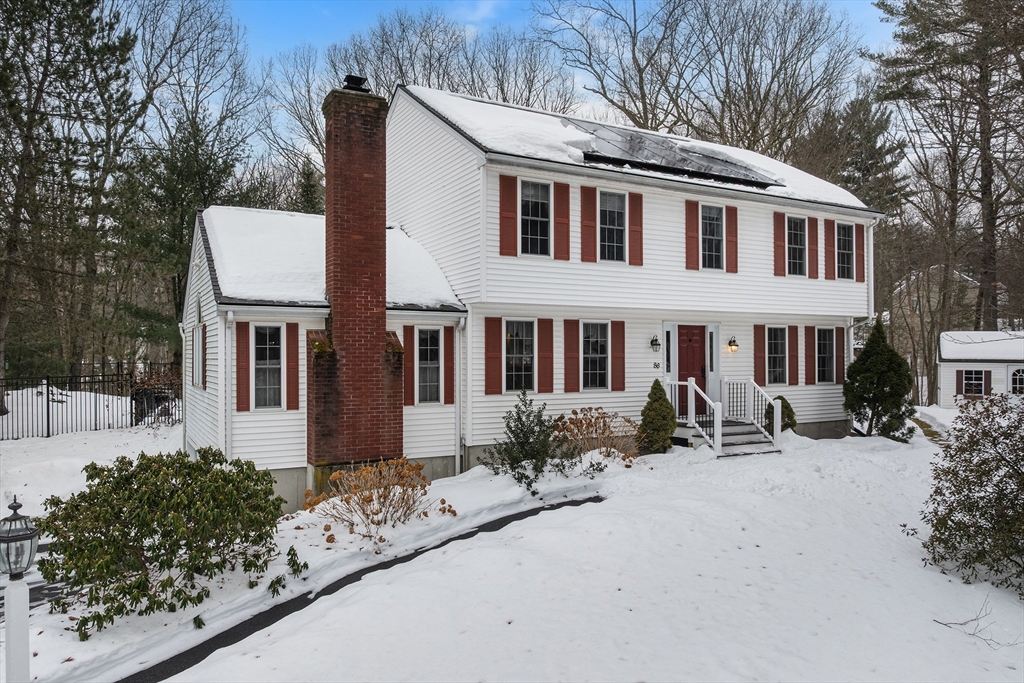 86 Hunter Road Uxbridge, MA 01569 - Photo 1 of 34 a front view of a house with yard and trees around
