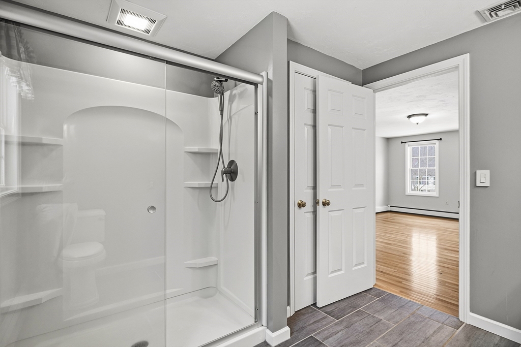 86 Hunter Road Uxbridge, MA 01569 - Photo 17 of 34 a bathroom with a shower and a sink