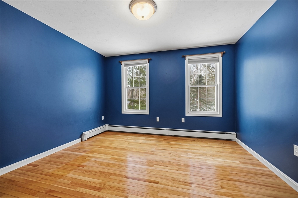 86 Hunter Road Uxbridge, MA 01569 - Photo 18 of 34 an empty room with windows