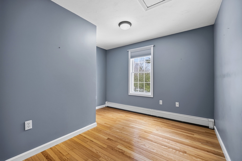 86 Hunter Road Uxbridge, MA 01569 - Photo 21 of 34 a view of empty room with wooden floor and fan