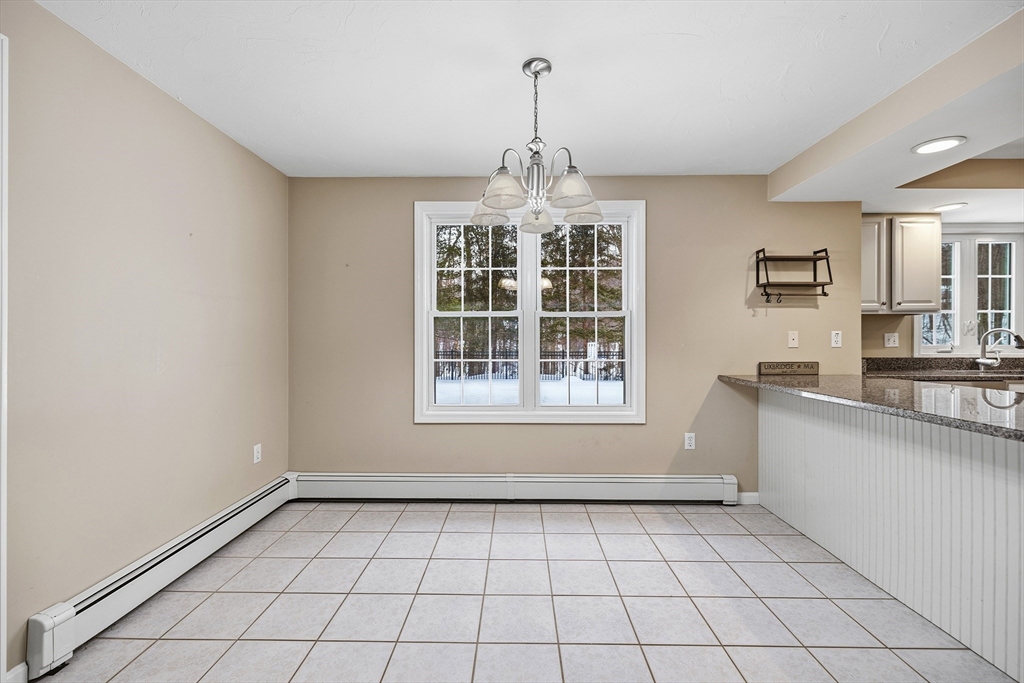 86 Hunter Road Uxbridge, MA 01569 - Photo 5 of 34 a view of an empty room with a window