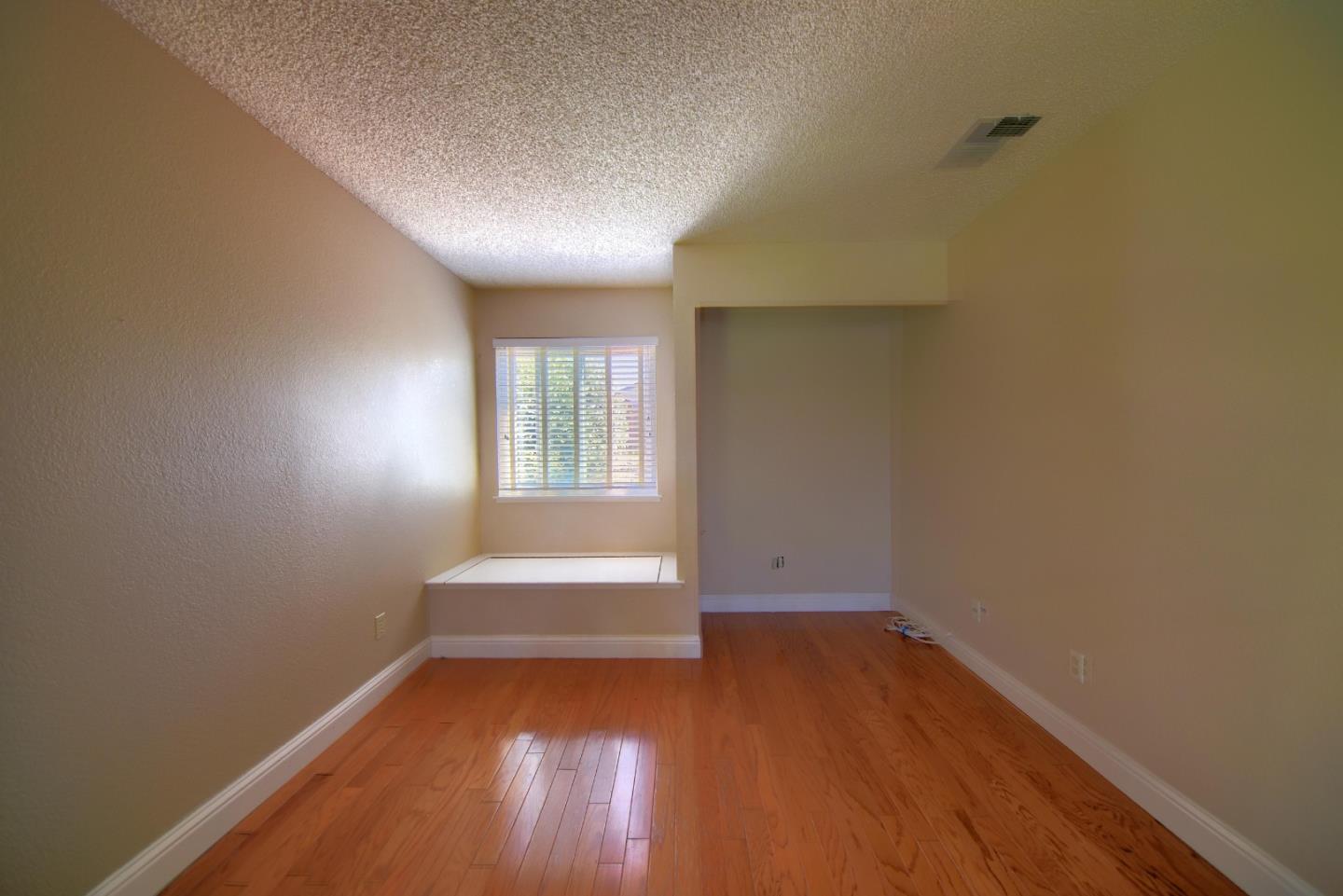 2911 Sunflower Drive Antioch, CA 94531 - Photo 37 of 69 an empty room with wooden floor and windows