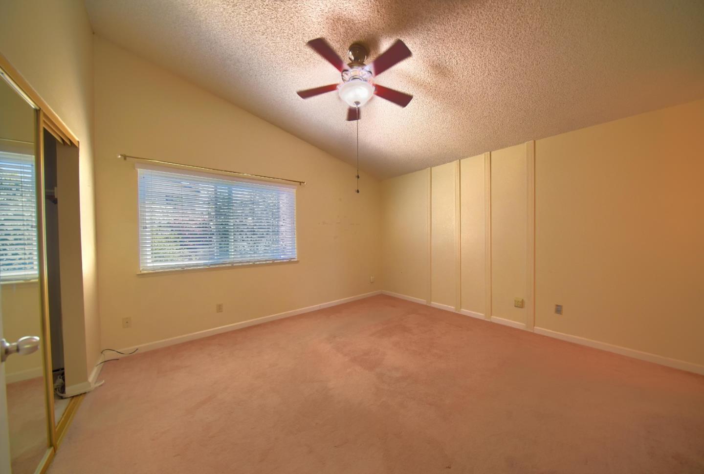 2911 Sunflower Drive Antioch, CA 94531 - Photo 39 of 69 an empty room with ceiling fan and window