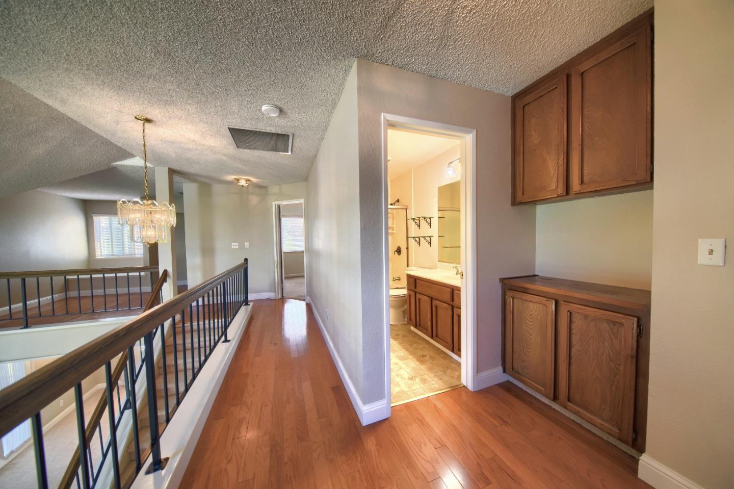 2911 Sunflower Drive Antioch, CA 94531 - Photo 46 of 69 a view of a hallway with wooden floor and staircase
