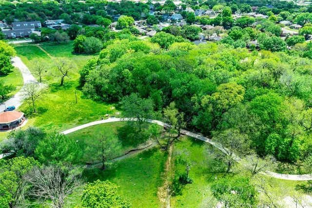 an aerial view of a houses with outdoor space and street view