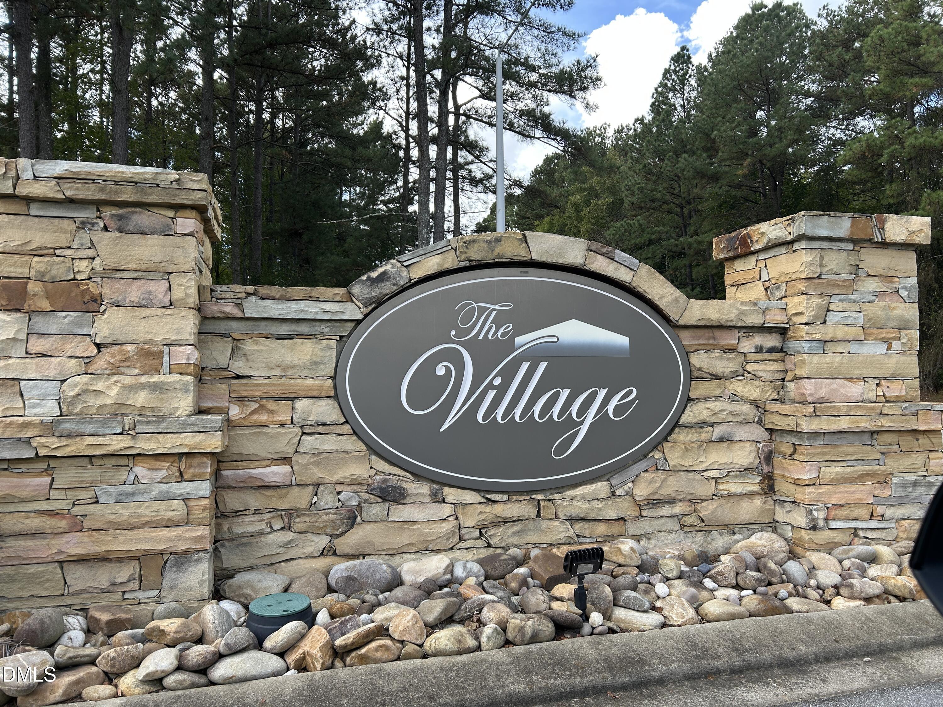 505 Easy Wind Lane Garner, NC 27529 - Photo 31 of 40 a sign that is on the side of a brick building