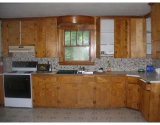 61 Parham Road Tyngsborough, MA 01879 - Photo 2 of 6 a view of a kitchen with a sink and large window
