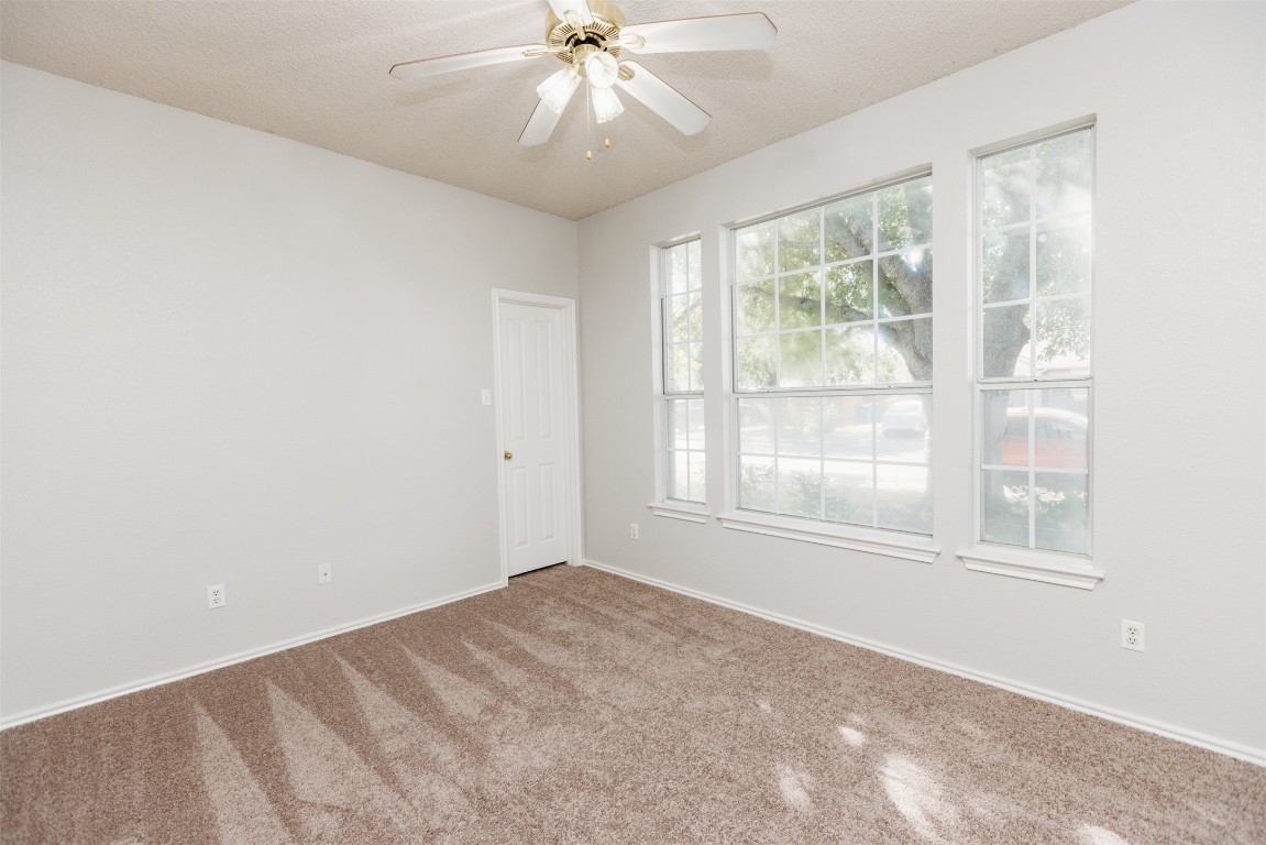 1506 Freestone Drive Pflugerville, TX 78660 - Photo 13 of 20 a view of an empty room with a window