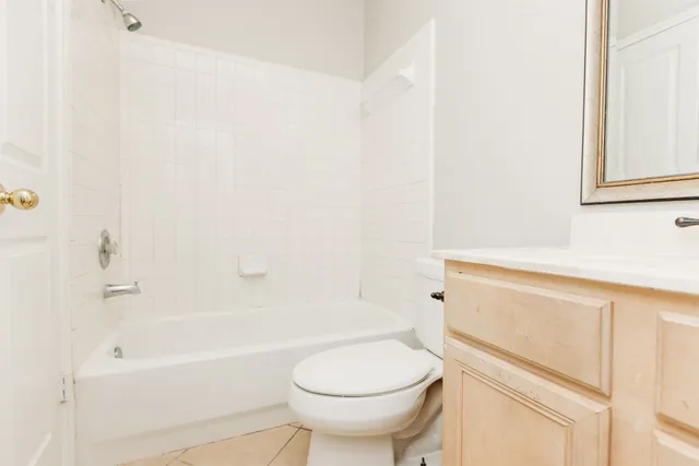 a bathroom with a sink a toilet and bathtub
