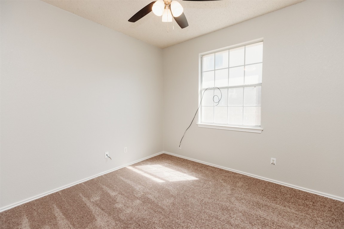 1506 Freestone Drive Pflugerville, TX 78660 - Photo 16 of 20 an empty room with a window and a ceiling fan