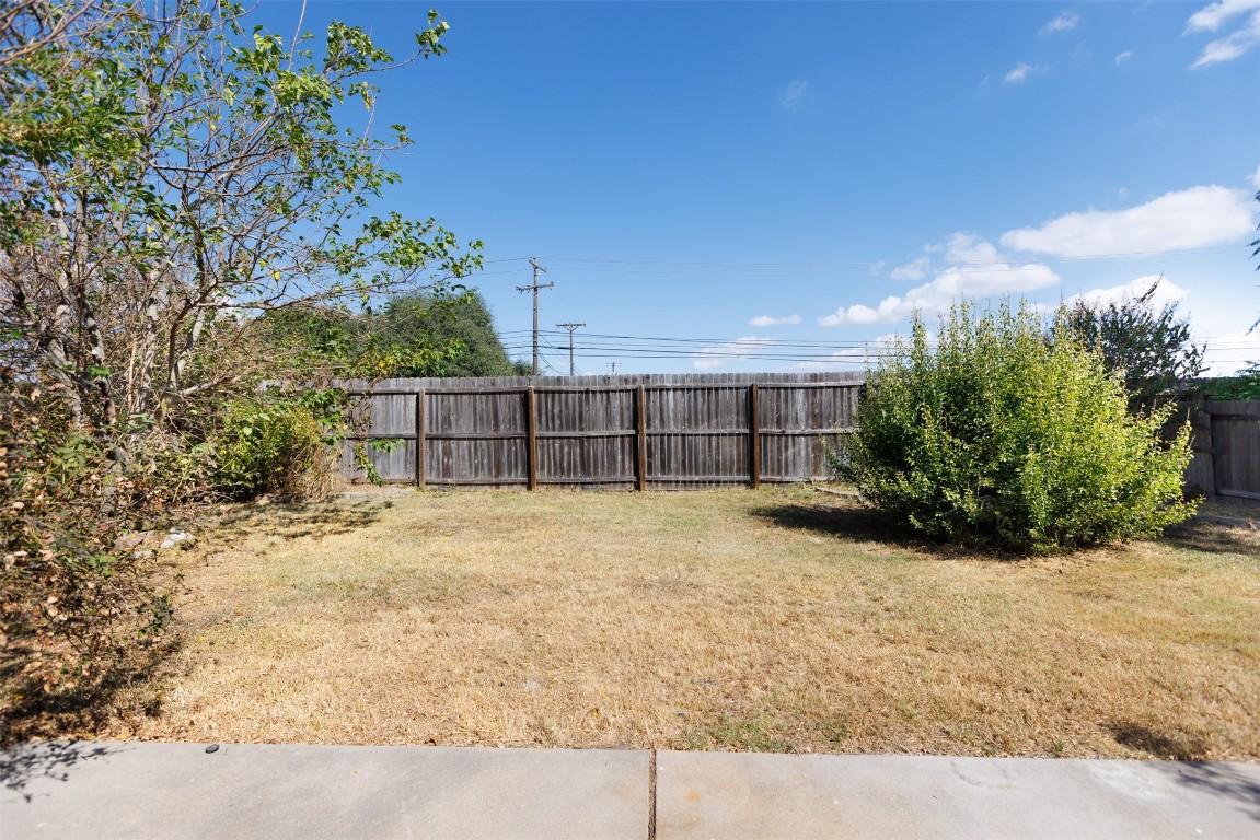 1506 Freestone Drive Pflugerville, TX 78660 - Photo 19 of 20 a view of a house with a yard and garage