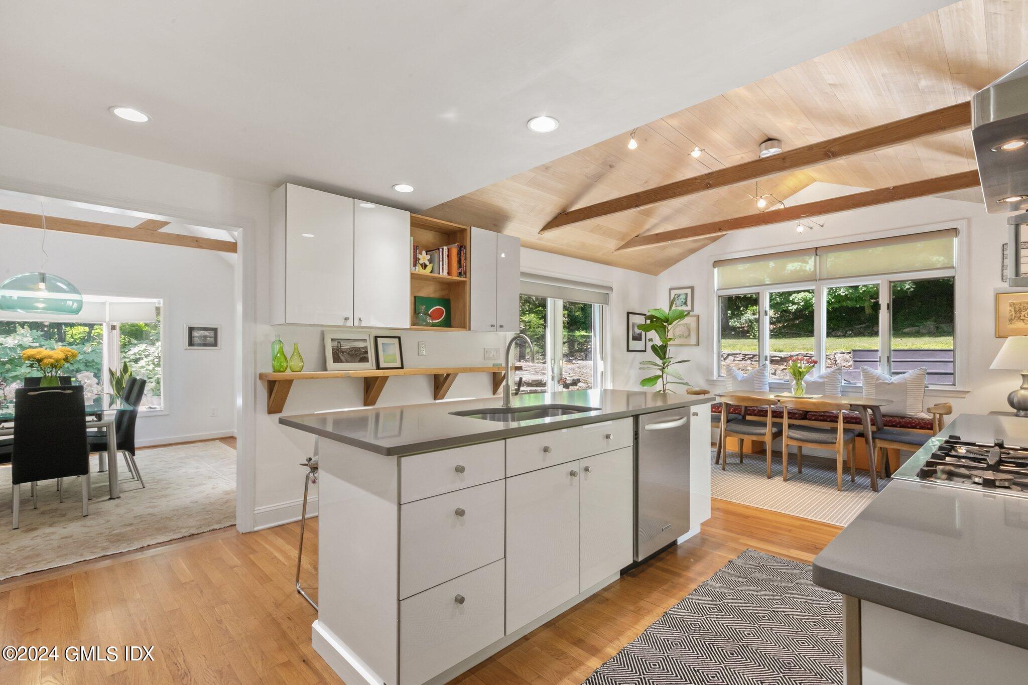 a kitchen with stainless steel appliances granite countertop a sink and cabinets