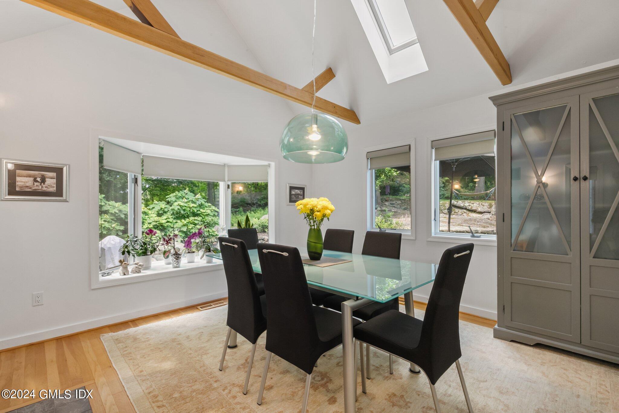 300 Orchard Street Greenwich, CT 06830 - Photo 12 of 40 a view of a dining room with furniture and chandelier