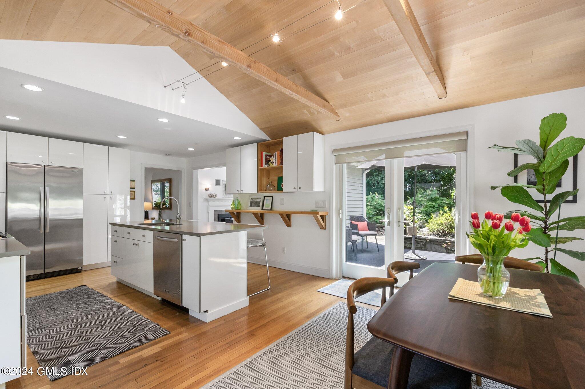 300 Orchard Street Greenwich, CT 06830 - Photo 15 of 40 a living room with stainless steel appliances furniture wooden floor and a kitchen view