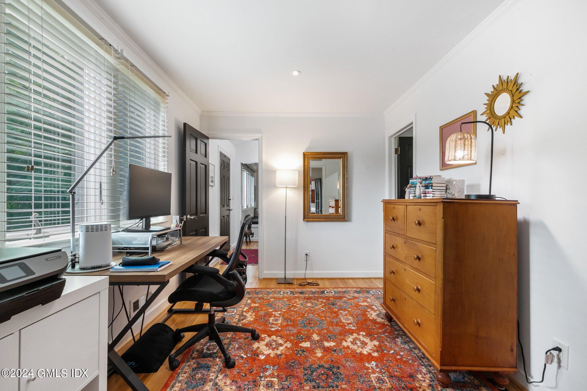 300 Orchard Street Greenwich, CT 06830 - Photo 18 of 40 a room with a desk and chair
