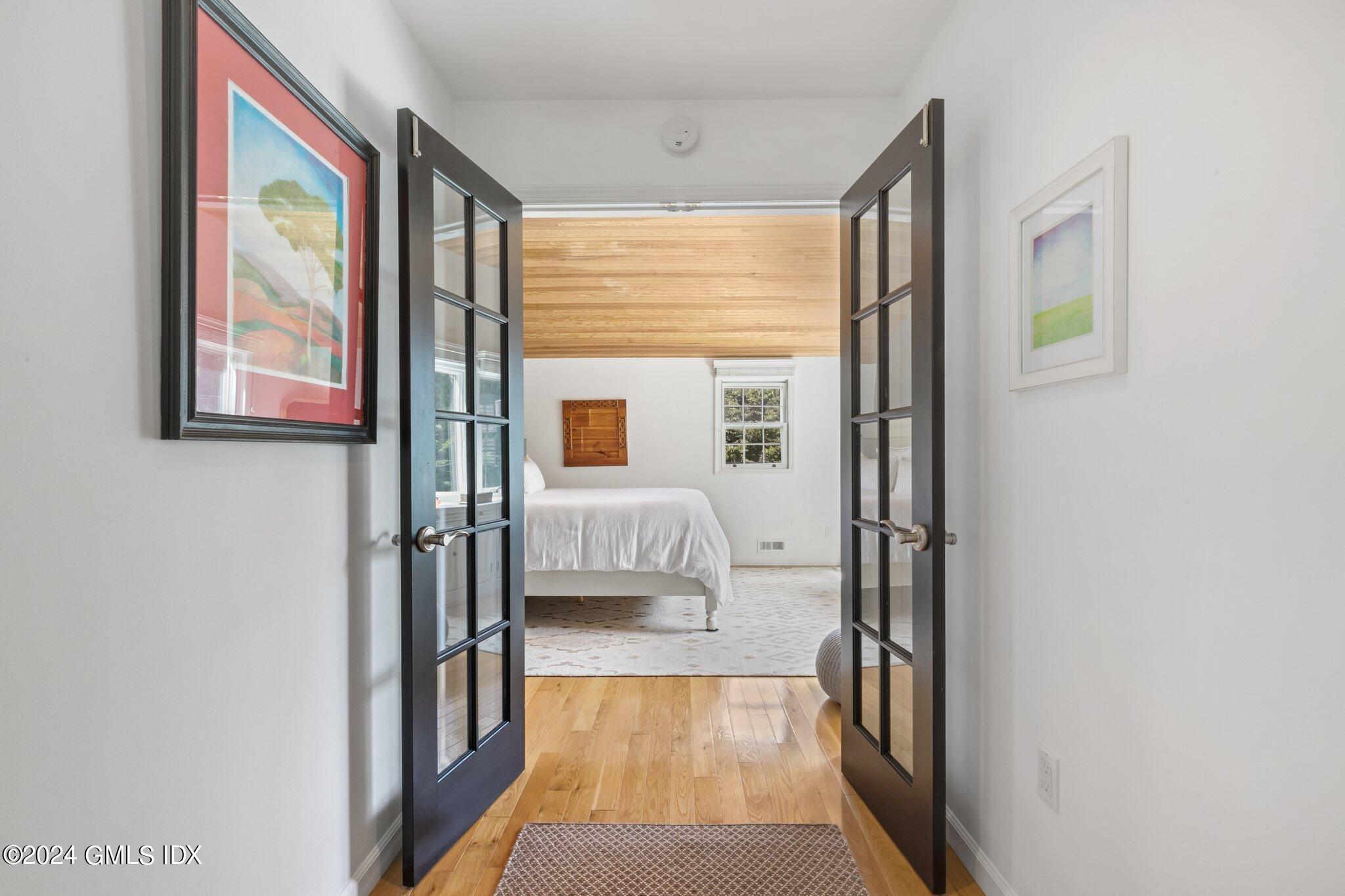 300 Orchard Street Greenwich, CT 06830 - Photo 20 of 40 a hallway with a large window and a hallway