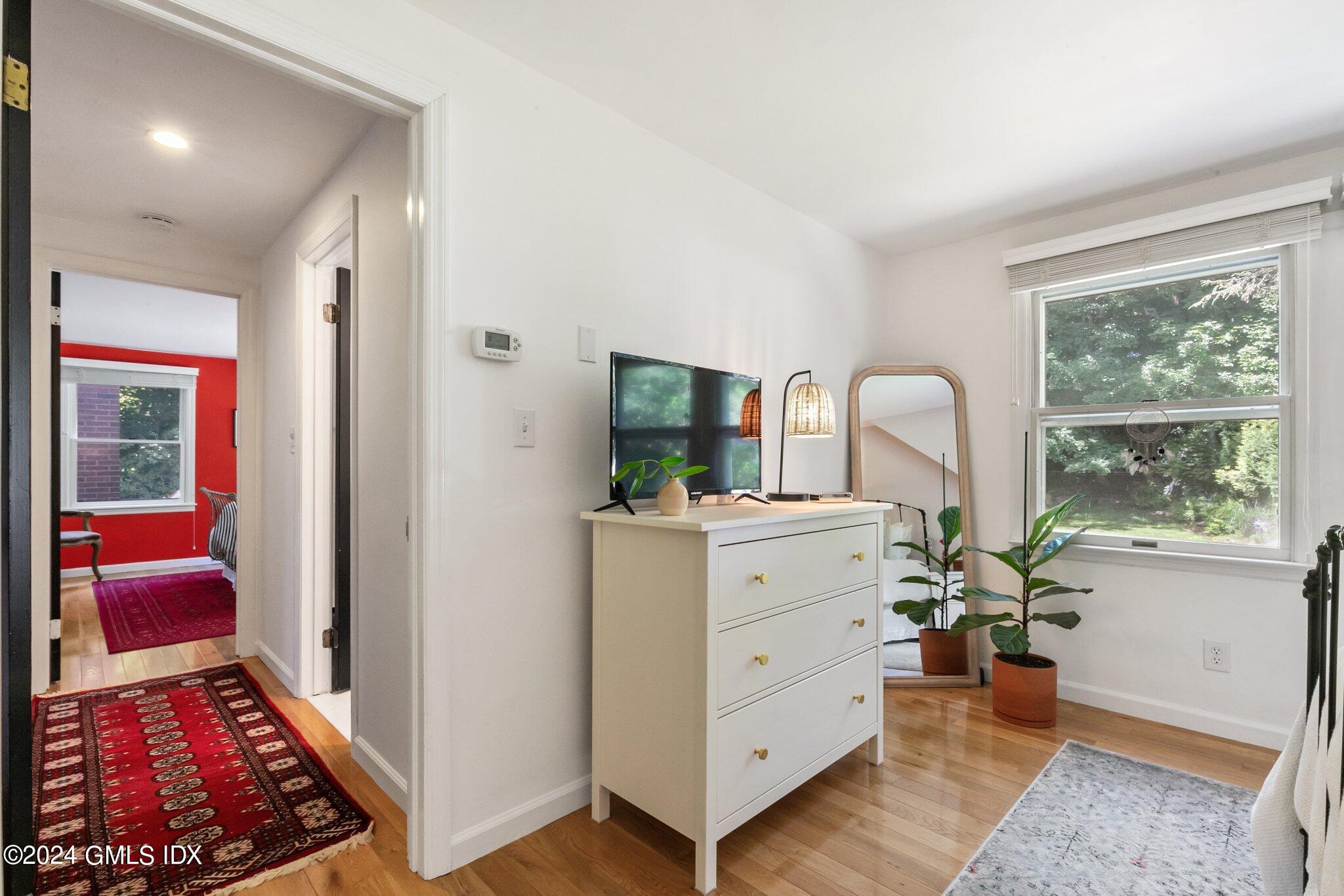 300 Orchard Street Greenwich, CT 06830 - Photo 30 of 40 a room with furniture and a window