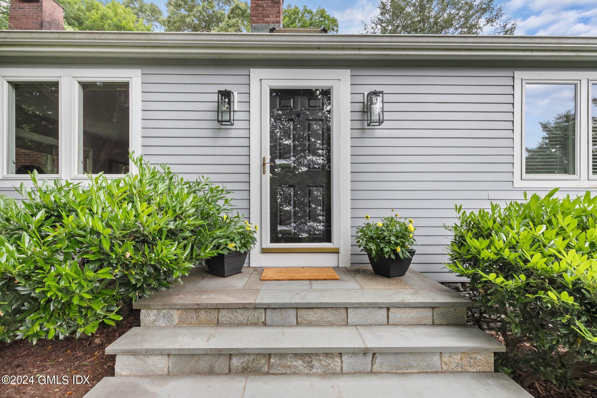 300 Orchard Street Greenwich, CT 06830 - Photo 3 of 40 a view of a entryway door front of a house